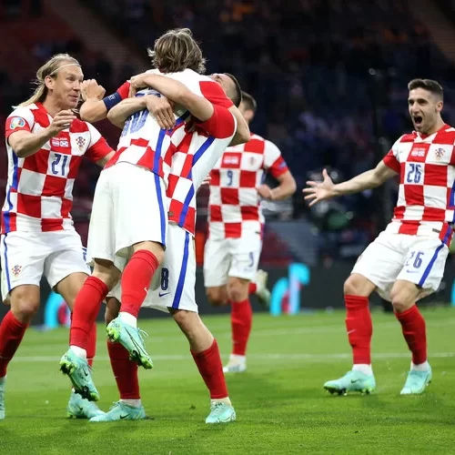 GLASGOW, SCOTLAND - JUNE 22: Luka Modric of Croatia celebrates with teammates Mateo Kovacic and Domagoj Vida after providing the assist for their side's third goal scored by Ivan Perisic of Croatia during the UEFA Euro 2020 Championship Group D match between Croatia and Scotland at Hampden Park on June 22, 2021 in Glasgow, Scotland. (Photo by Steve Bardens - UEFA/UEFA via Getty Images)